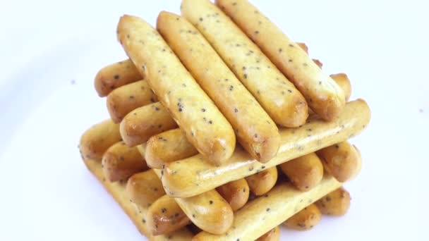 Biscuit sticks with poppy seeds — Stock Video