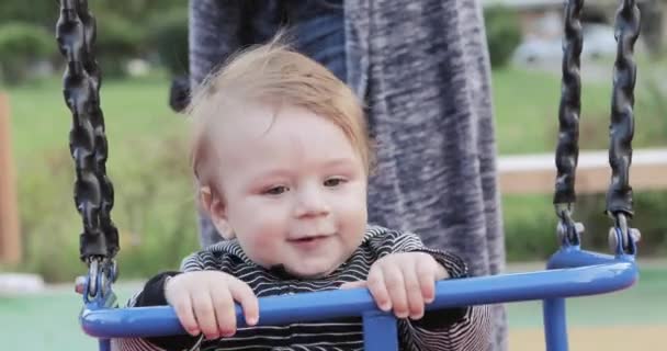 Baby boy on a swing — Stock Video