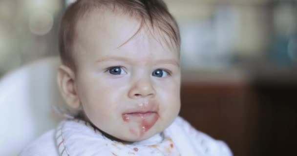 Baby boy eating currant puree — Stock Video