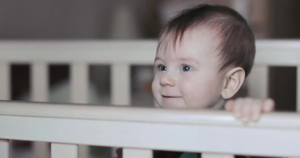 Baby boy in a crib — Stock Video