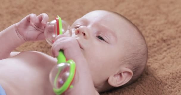 Baby with a rattle — Stock Video