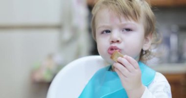 Boy eats lard and rusks