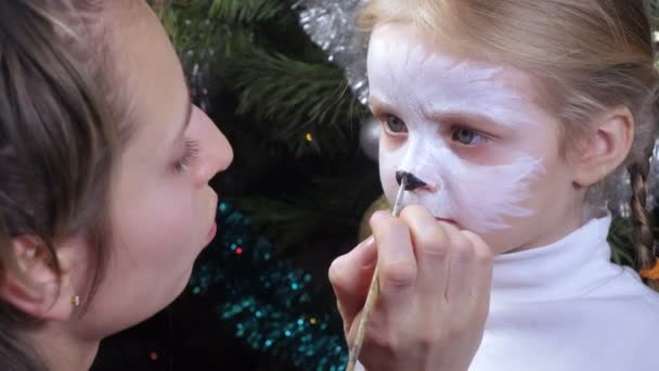 On girl painted on face — Stock Video