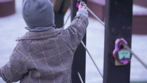 Boy playing with padlocks — Stock Video