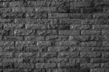 karanlık taş doku ve arka plan siyah tuğla duvar 