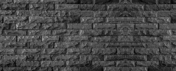 Panorama siyah tuğla duvar koyu taş doku ve arka plan 