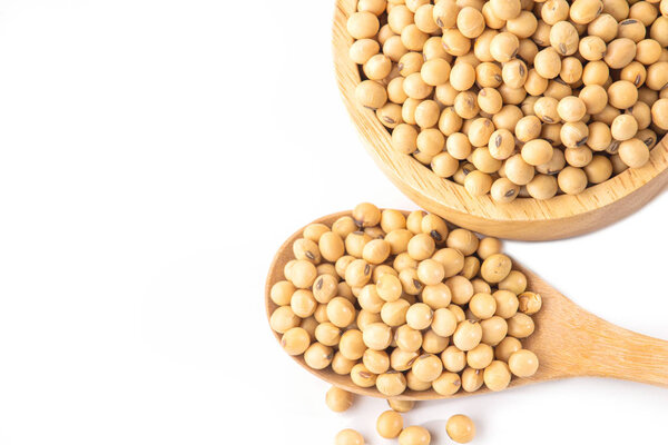 soy beans in wooden bowl and spoon isolated on white background 