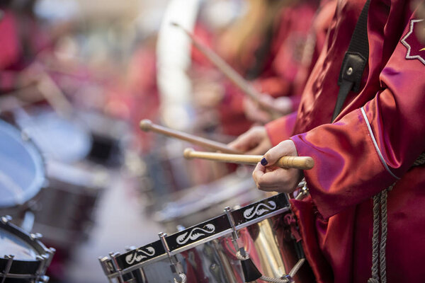 close-up of hands playing the drum during easter