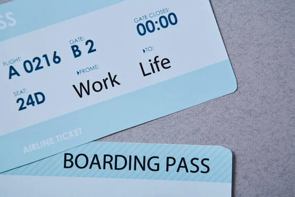 Work life balance choice concept. Boarding pass boarding pass on grey background — 스톡 사진