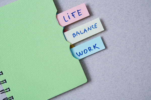 Work life balance choice concept. Stickers with inscriptions in a notebook.