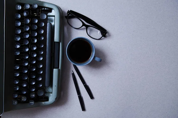 Literature, author and writer, writing and journalism concept: typewriter, cup of coffee and glasses and a paper — Stock Photo, Image
