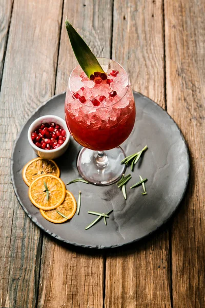 Lemonade or juice. Alcohol drink or cocktail. Images for bar or restaurant menu. Red drink with ice lemon and berries — Stock Photo, Image