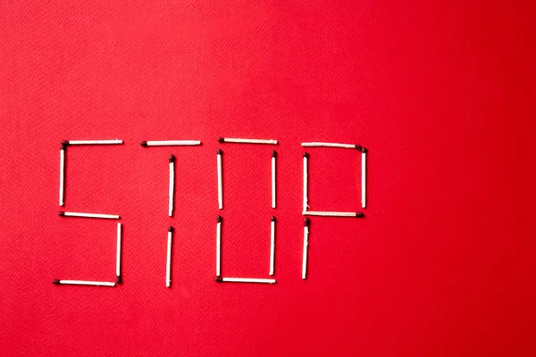 Fire safety, or security and protection concept. Stop sign of matches on a red background. — Stock Image Fire safety, or security and protection concept. Stop sign of matches on a red background. Stock Picture