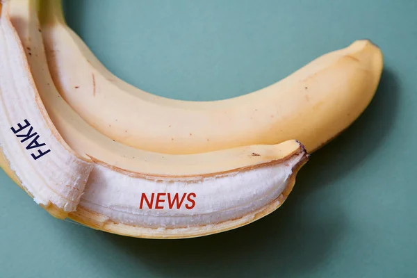 Fake news, disinformation or false information and propaganda concept. Banana and inscription