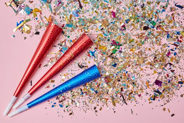 Festive event. Party. Celebration anniversary and Decor. Exploding firecrackers or colourful confetti. Pink background