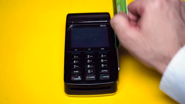 Businessman using payment terminal. Businessman pays for the purchase by credit card — Stock Video