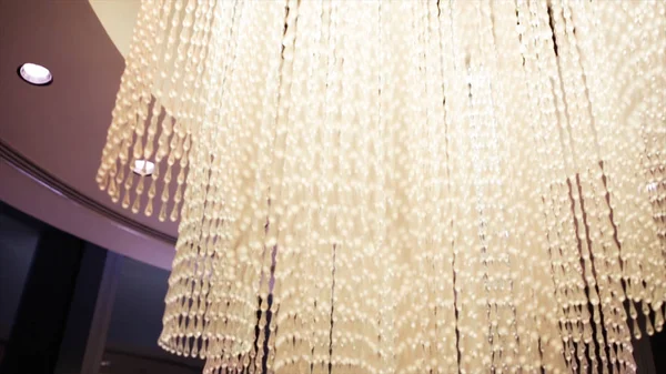 Beautiful Chandelier Lighting Crystal. Stock. High chandelier in a luxury hotel — Stock Photo, Image
