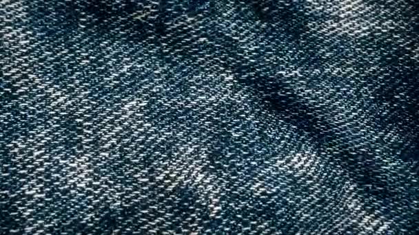 Denim tyg texturerat blå fladdrande. Animerade rörelser av duken. Bakgrunden animation jeans som fladdrar i vinden. Vågor av materialet — Stockvideo