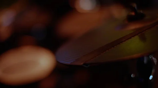 Close-up of drum plate hi hat and a drummer playing on drums. Stock. Drummer Playing Drum