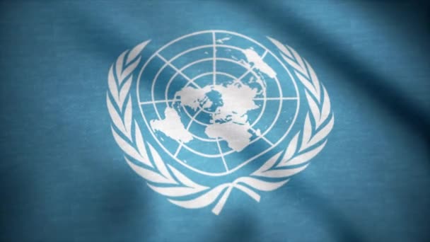 Bandeira das Nações Unidas. A bandeira das Nações Unidas acenando ao vento. Bandeira internacional da ONU — Vídeo de Stock