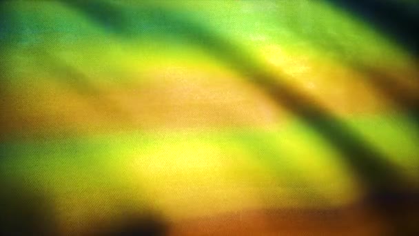 Bakgrund av mönstrade gula tyg simulering. Färgglada bomull tyg bakgrund. Vågor av tygduk i vinden. Fina sidentyg. Dekorativa tyg. — Stockvideo