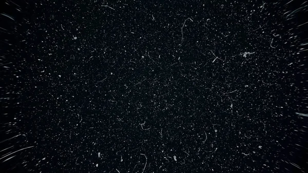 White dust particles moving slowly in space on black background. Abstract particle moving background. Slow motion macro dust particles explosive flow over black background