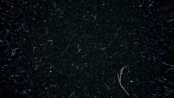 White dust particles moving slowly in space on black background. Abstract particle moving background. Slow motion macro dust particles explosive flow over black background