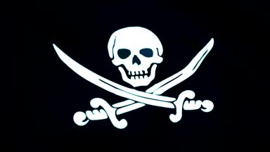 Korsan bayrağı closeup animasyon. Jolly Roger hakkında saldırmak için korsan gemisi tanımlamak için uçakla bayrakları geleneksel İngiliz adıdır. Korsan bayrağı yavaş hareket döngü