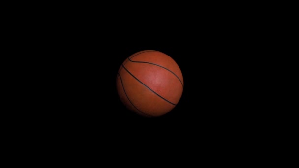 Nahtlose Looping-Animation des Basketballs auf schwarzem Hintergrund. Sport- und Freizeitkonzept. Animation eines Basketballs — Stockvideo