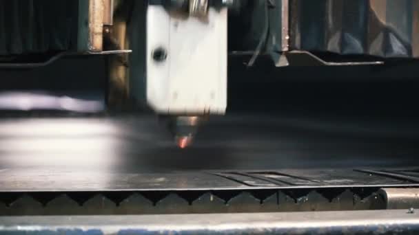 Laser machine cutting of sheet metal. Clip. Sparks fly from laser by automatic cutting CNC, PLC machine — Stock Video