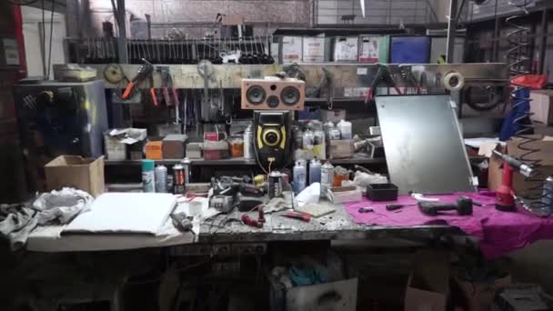 Complete workbench with a wall of tools in a workshop. Clip. Table with tools in the garage — Stock Video