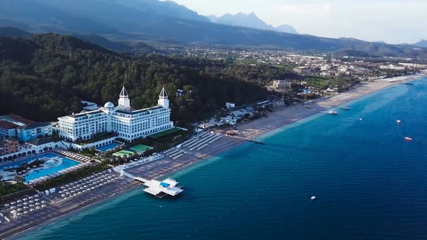 Beautiful resort town near the sea, top view. Video. Tourist zone at the pier in the bay