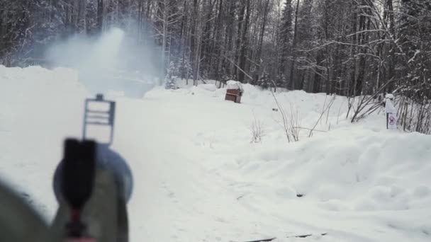 Tank or armored personnel carrier in winter forest. Clip. Shot from a grenade launcher on the tank in the winter forest. The attack on the APC with a grenade launcher — Stock Video