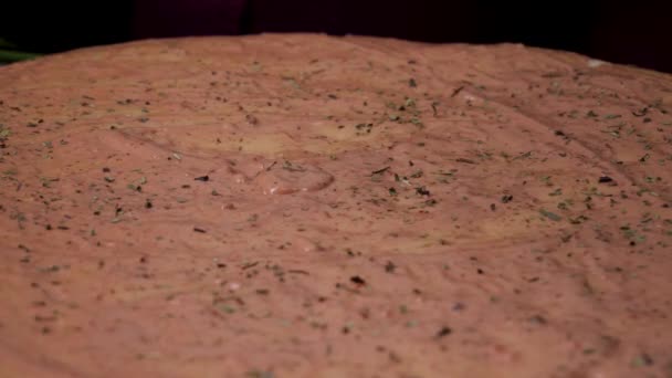 Hands preparing a pizza. Frame. Cook in the kitchen putting the ingredients on the pizza. Pizza concept. Production and delivery of food. Closeup hand of chef baker in white uniform making pizza at — Stock Video