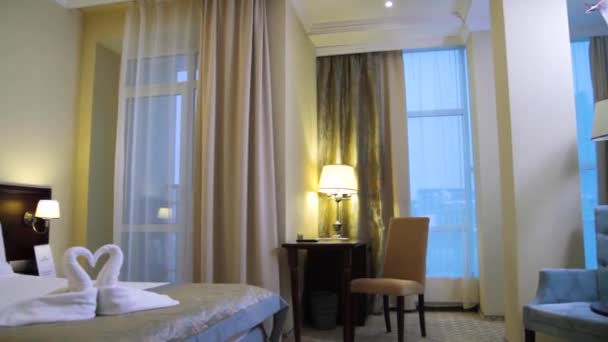 Interior of a modern hotel bedroom. Scene. Interior of a room in the hotel — Stock Video