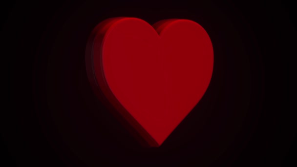 Animation d'un cœur rouge rotatif sur fond noir. Concept d'amour 