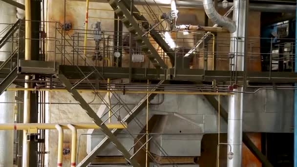 Construction of building interior of factory. Modern industrial building. Equipment and piping as found inside of industrial thermal power plant. Industrial background. — Stock Video