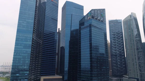 Singapore - August, 2018: Top view of panoramic scene of day of majestic cityscape with modern new buildings. Shot. Modern futuristic buildings architecture. Top view of megapolis skyscrapers with — Stock Photo, Image