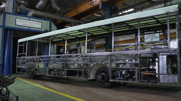 Bus production manufacture. Scene. Inside bus factory. Almost ready-made buses at factory. Concept of passenger buses