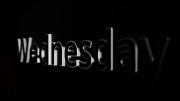 Palabra wednesday animación sobre fondo negro se acerca y se aleja. La animación del día de la semana - el miércoles . — Vídeo de stock