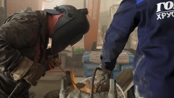 Male person in protective mask welding metall construction, concept of manufactory. Frame. Close up of welder working in workshop. — Stock Video