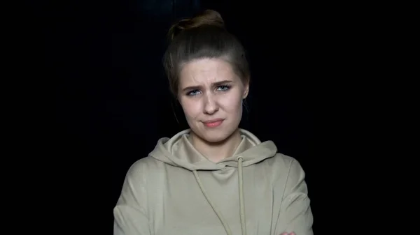 Young woman with irritated facial expression. Human facial expressions and emotions. Beautiful young woman with disappointed expression crossed her hands — Stock Photo, Image