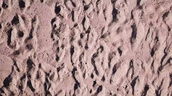 Caméra survolant la plage de sable, mouvement de glissement. Fond de sable. gros plan de sable d'une plage. Texture sable. Vue rapprochée fond de plage . — Photo