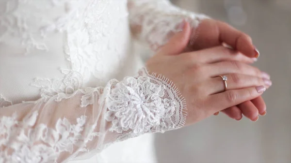 Close up of elegant ring on the finger. Soft and selective focus. Close-up of tender ring on brides hand with white nails — Stock Photo, Image