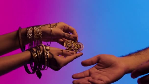 Female Mehendi Hands Giving Golden Eastern Vintage Handmade Earrings Colourful — Stock Video