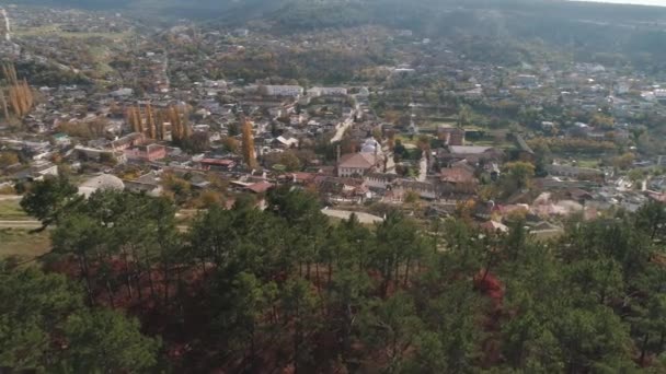 Beautiful landscape of a town located between the hills in the lowlands. Shot. View from the top of the hill — Stock Video