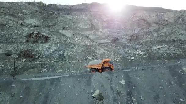 Dump truck loaded with chalk moving on a quarry road. Quarry and mining equipment. — Stock Video