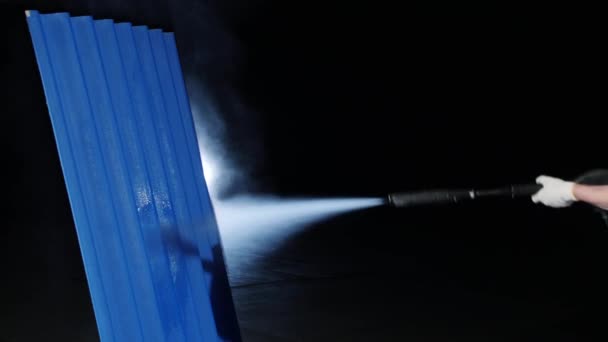 Male worker in uniform and working gloves spraying the piece of metal. Spraying machine. — Stock Video