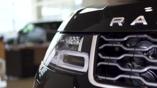 Close up detail for one of the LED headlights of a modern black car. Stock. Exterior detail, headlight of a prestigious vehicle, luxury concept. — Stock Video