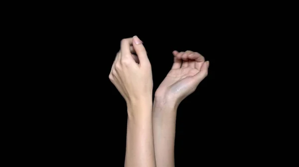 Mãos aplaudindo isolado em um fundo preto. palmas mãos sobre um fundo preto — Fotografia de Stock
